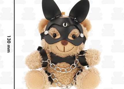 Ein beiger plüsch-teddybär fetisch submissive mishka teddyBär bdsm modell 5 mit schwarzer ledermaske und metallkette