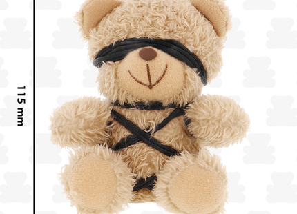 Beiger plüsch-teddybär mit schwarzer blindfold und überkreuztem geschirr im fetish submissive winnie teddybär bdsm modell 6