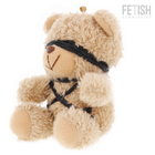 Ein plüschiger beiger teddy mit lockigem fell und schwarzen stoffriemen im fetish submissive winnie teddybär modell 6