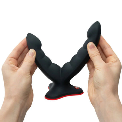 Schwarzer silikon analplug mit roter akzentlinie und strukturierter segmentierung von fun factory ryde doppeldildo massager