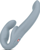 Grauer silikon doppelkopf vibrierer mit strukturierter griff und rotem power-knopf fun factory share vibe pro doppelvibrator violett