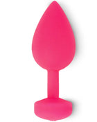 Ein lebhaft pinkfarbener teardrop-förmiger butt plug aus silikon mit sechseckiger basis von funtoys/gplug anal-vibrator gross 3,9 cm