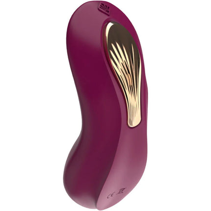 Ein eleganter, gebogener lila g spot sucker und stimulator mit goldfarbener strukturierter oberfläche und subtiler markierung