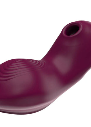 Ein elegantes dunkelviolettes silikonspielzeug mit glattem, geschwungenem design und wellenstruktur für g punkt stimulation