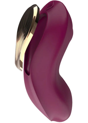 Ein schlankes, tiefviolettes silikon g punktsauger und stimulator mit goldfarbenem metallakzent und elegantem fächerdesign