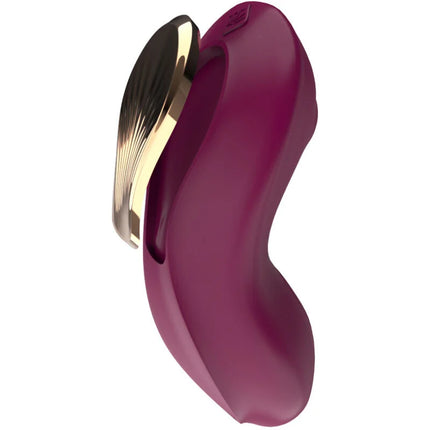 Ein schlankes, tiefviolettes silikon g punktsauger und stimulator mit goldfarbenem metallakzent und elegantem fächerdesign