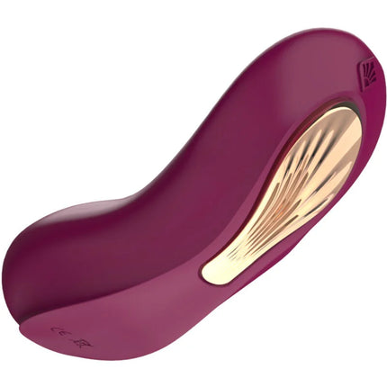 Ein eleganter, gebogener violetter und goldener g spot sucker und stimulator mit glänzendem finish aus glattem material