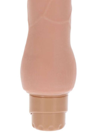 Beiger silikon dildo mit glatter vibratorhaut, texturiertem griff und abgerundetem fuß, duale dichte