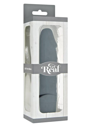 Ein eleganter, matter grauer silikon-vibrator get real mini classic in klarer plastik- und grauer kartonverpackung