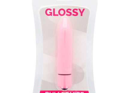 Glänzender pinker dünner vibrierender dildo aus kunststoff in transparenter plastikverpackung namens glossy rosa
