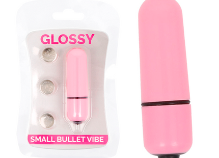 Glänzender kleiner kugel-vibrator aus rosa plastik mit schwarzem akzentband und spitze