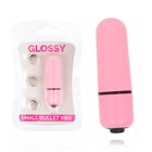Glänzender kleiner kugel-vibrator aus rosa plastik mit schwarzem akzentband und spitze