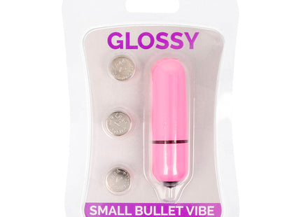 Glänzender kleiner bullet-vibrator aus pinkem kunststoff mit schwarzem ring und metallspitze im tiefrosa farbton