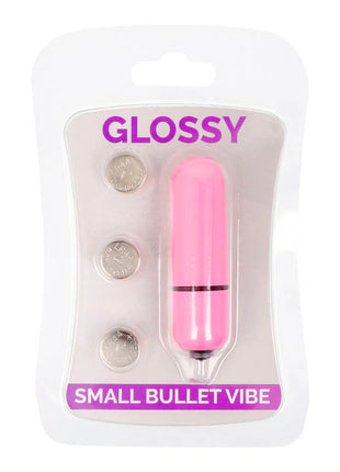 Glänzender kleiner bullet-vibrator aus pinkem kunststoff mit schwarzem ring und metallspitze im tiefrosa farbton