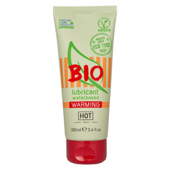 Ein blassgrünes und orangenes rohr des bio wasserbasierten wärmenden schmiermittels hot mit rotem deckel 100 ml