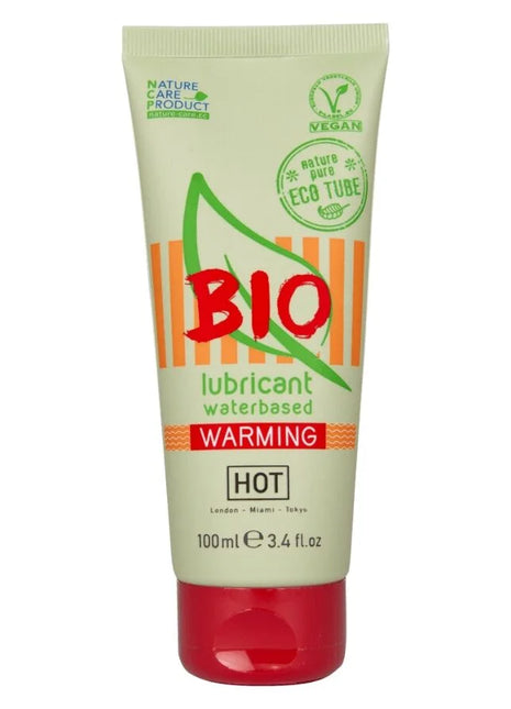 Ein blassgrünes und orangenes rohr des bio wasserbasierten wärmenden schmiermittels hot mit rotem deckel 100 ml