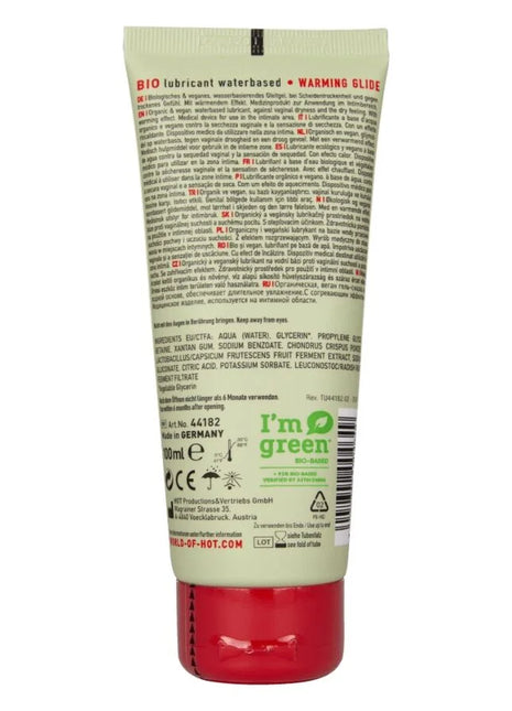 Ein roter und weißer tube i’m green bio-schmiermittel auf wasserbasis mit wärmewirkung und warming glide formel 100 ml