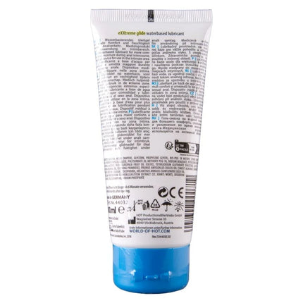 Weiße tube exxtreme glide wasserbasiertes gleitmittel mit silbernem deckel und mehrsprachiger beschriftung