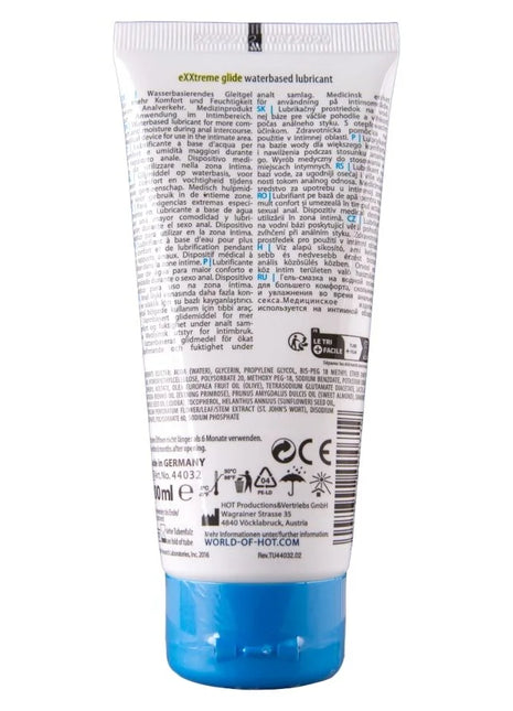 Weiße tube exxtreme glide wasserbasiertes gleitmittel mit silbernem deckel und mehrsprachiger beschriftung