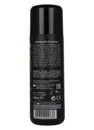 Schwarze zylindrische spraydose extreme glide silikonbasiertes gleitmittel mit mehrsprachigem text und barcode rückseite