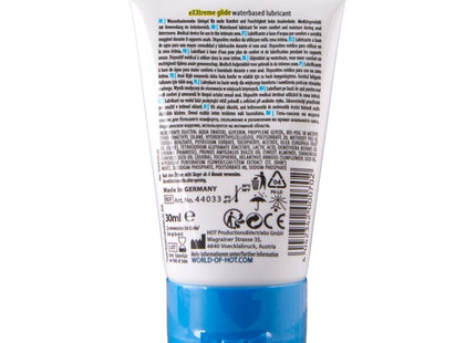 Weiße plastiktube mit blauem verschluss und mehrsprachigem etikett für hot extratreme wasserbasiertes gleitmittel 30 ml