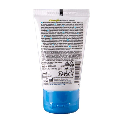 Weiße plastiktube mit blauem verschluss und mehrsprachigem etikett für hot extratreme wasserbasiertes gleitmittel 30 ml