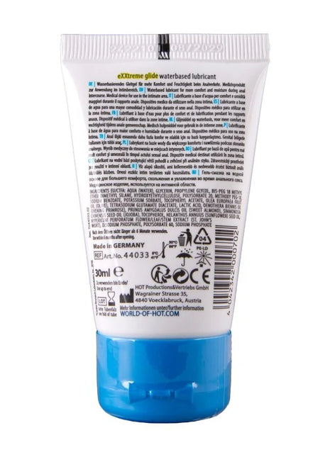 Weiße plastiktube mit blauem verschluss und mehrsprachigem etikett für hot extratreme wasserbasiertes gleitmittel 30 ml