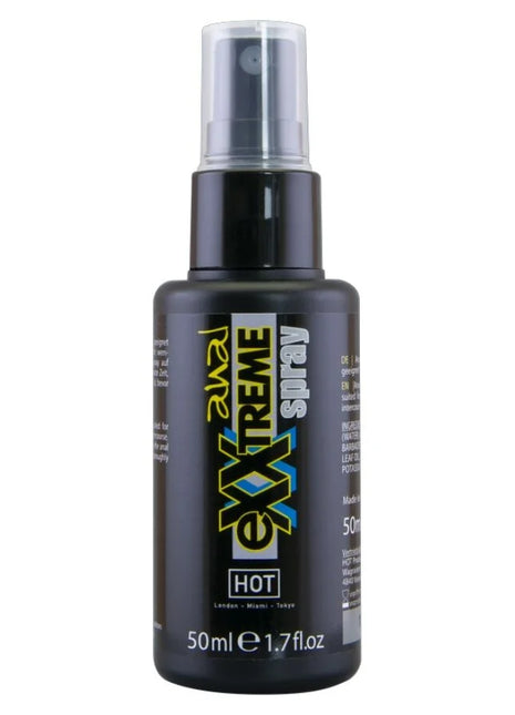 Schwarze kunststoff-sprühflasche mit klarem sprühkopf und etikett revel xxtreme hot spray für analgebrauch 50 ml