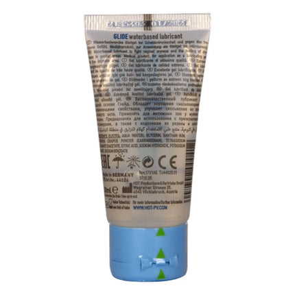 Ein durchsichtig weißer schlauch mit blauer kappe und silbernem riffelverschluss für hot glide wasserbasiertes gleitmittel 30 ml