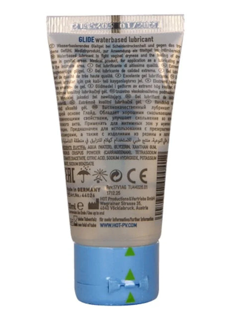 Ein durchsichtig weißer schlauch mit blauer kappe und silbernem riffelverschluss für hot glide wasserbasiertes gleitmittel 30 ml