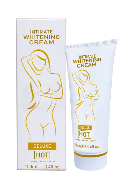 Weiße tube und passende box der intimen aufhellungscreme hot mit goldfolie und stilisiertem weiblichem motiv