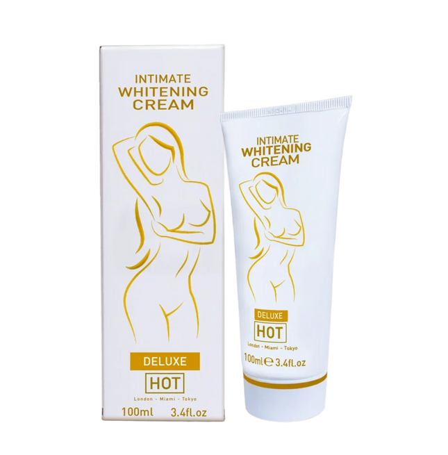 Weiße tube und passende box der intimen aufhellungscreme hot mit goldfolie und stilisiertem weiblichem motiv