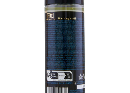 Klar glasflasche mit schwarzem verschluss und dunkelblauem etikett mit hellem gelbem massageöl hot massageöl exotisch spezial 100 ml