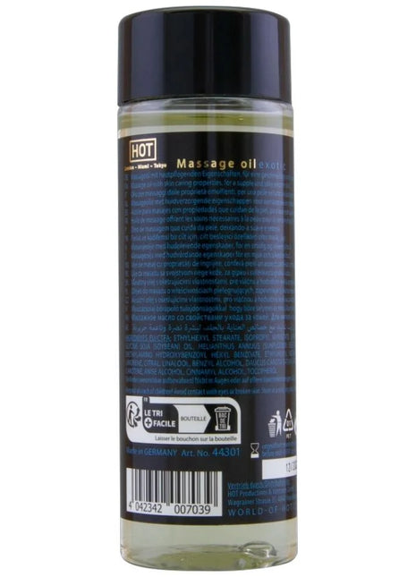 Klar glasflasche mit schwarzem verschluss und dunkelblauem etikett mit hellem gelbem massageöl hot massageöl exotisch spezial 100 ml