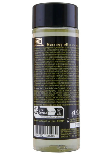 Klar glasflasche mit schwarzem deckel und bernsteinfarbenem massageöl hot massageöl jasmin 100 ml label