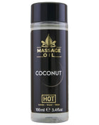 Hot massageöl kokosnuss 100 ml in klarer glasflasche mit schwarzem und goldenem etikett für entspannende massages