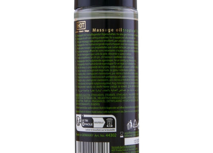Klare glasflasche mit schwarzem verschluss und etikett enthält tropisches massageöl hot - massageöl tropische früchte 100 ml