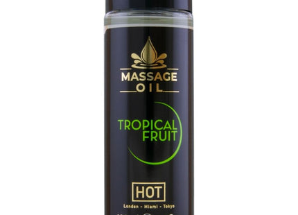 Schwarze zylindrische flasche mit tropisch-fruchtigem massageöl hot massageöl tropische früchte 100 ml mit glänzendem schwarzen deckel und goldener beschriftung