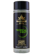 Schwarze zylindrische flasche mit tropisch-fruchtigem massageöl hot massageöl tropische früchte 100 ml mit glänzendem schwarzen deckel und goldener beschriftung
