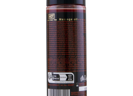 Eine klare kunststoffflasche mit schwarzem deckel, gefüllt mit rotem warmem massageöl hot von london miami tokyo 100 ml