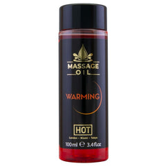 Schwarze zylindrische flasche hot massageöl wärmend 100 ml mit glänzendem schwarzen deckel und rotem boden
