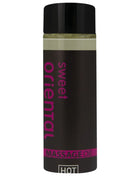 Ein schwarzes, glänzendes fläschchen mit pinkem sweet oriental massageöl text für orientalisches Massageöl süß 100 ml