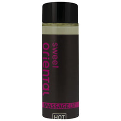 Ein schwarzes, glänzendes fläschchen mit pinkem sweet oriental massageöl text für orientalisches Massageöl süß 100 ml