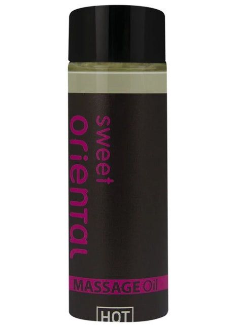 Ein schwarzes, glänzendes fläschchen mit pinkem sweet oriental massageöl text für orientalisches Massageöl süß 100 ml