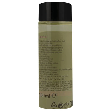 Eine klare glasflasche mit schwarzem deckel enthält olivgrünes hot orientalisches massageöl süß 100 ml