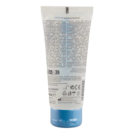 Ein durchscheinendes blaues plastikrohr mit hot superglide wasserbasiertem gleitmittel 100 ml mit weißem etikett und schwarzer schrift
