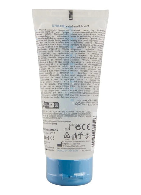 Ein durchscheinendes blaues plastikrohr mit hot superglide wasserbasiertem gleitmittel 100 ml mit weißem etikett und schwarzer schrift