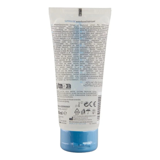 Ein durchscheinendes blaues plastikrohr mit hot superglide wasserbasiertem gleitmittel 100 ml mit weißem etikett und schwarzer schrift