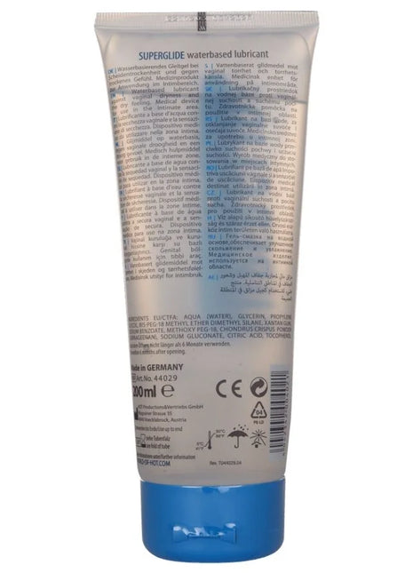 Ein silberfarbener, zusammendrückbarer tube mit blauem verschluss von hot superglide wasserbasiertem gleitmittel 200 ml