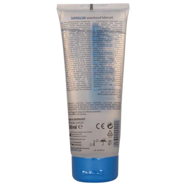 Ein silberfarbener, zusammendrückbarer tube mit blauem verschluss von hot superglide wasserbasiertem gleitmittel 200 ml